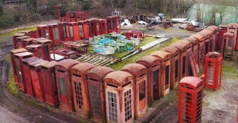 Incredible ‘graveyard’ of British red phone boxes tucked away next to Surrey railway line