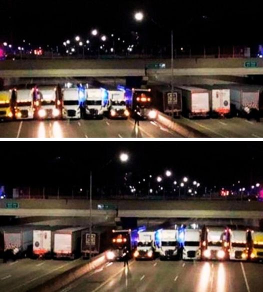 Thirteen trucks mysteriously block the highway